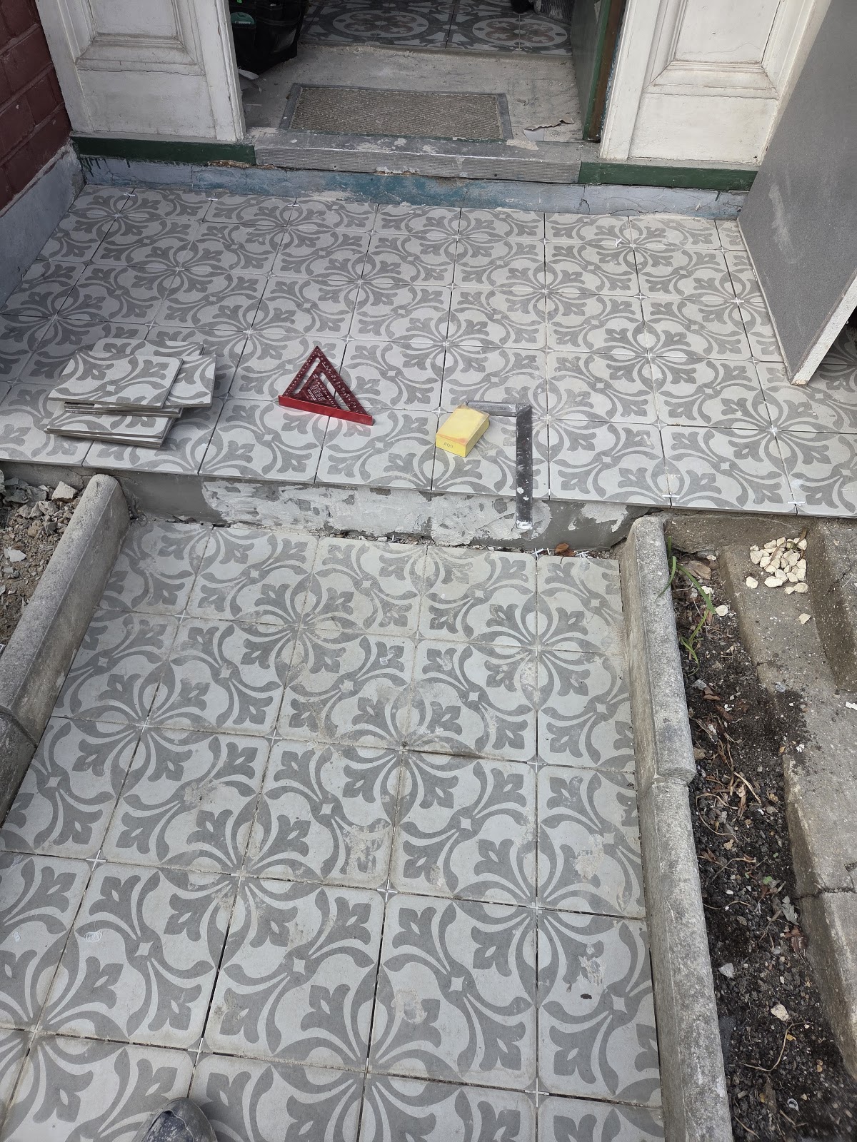 Victorian-style patterned tiles on a front path and porch, London